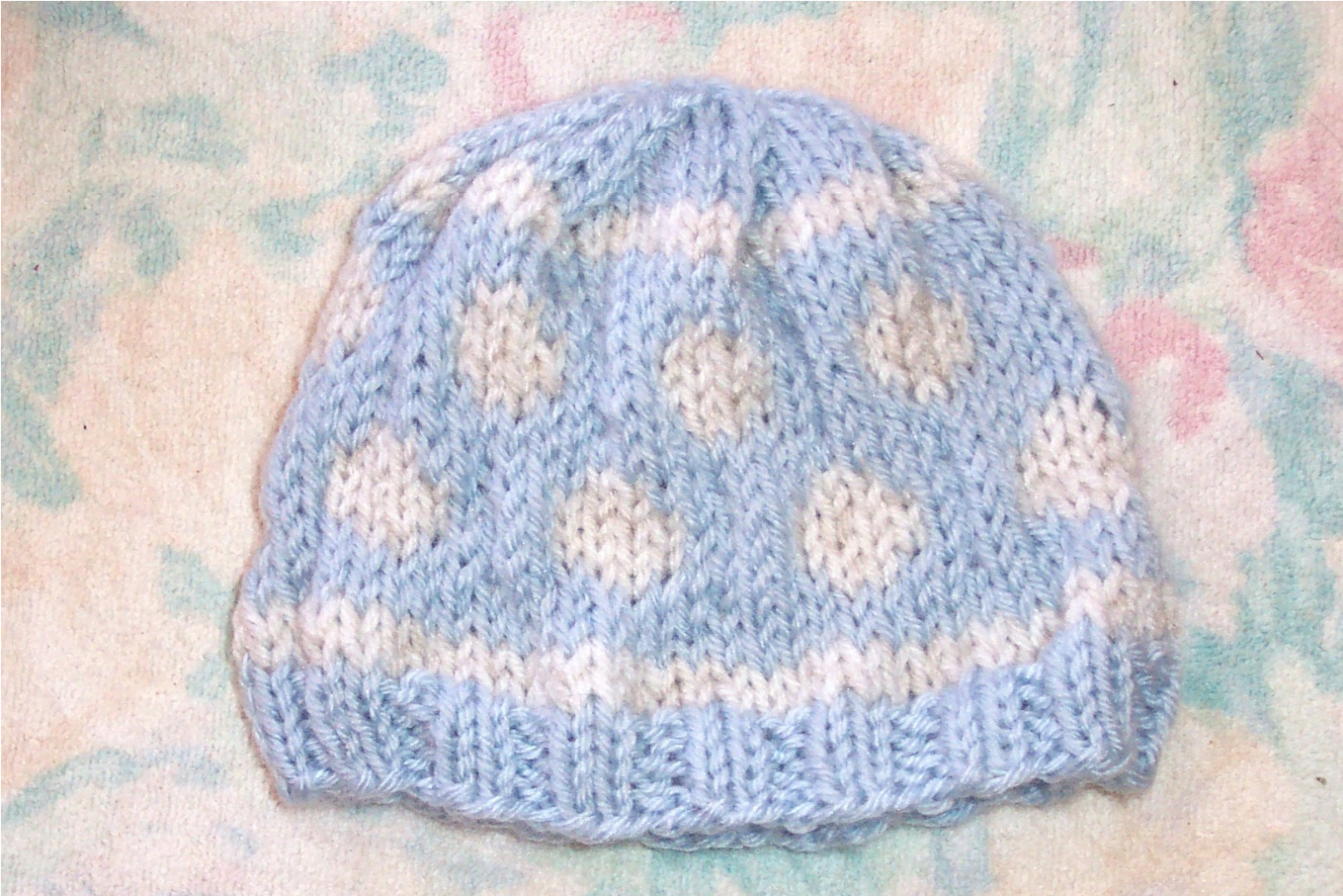 SmoothFox's Baby Bubbles Knit Hat Pattern for Newborns with Advanced Beginner Knitting Techniques and Color Stranding pattern preview