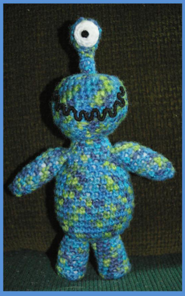 Amigurumi Alien Pattern: A Simple Crochet Design for a Lovable Bedtime Friend with Variegated Wool Yarn pattern preview