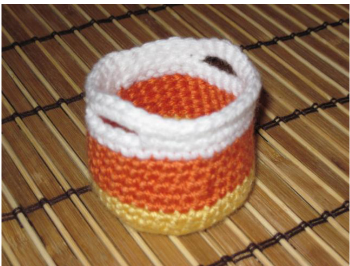 Crochet Pattern for Mini Candy Corn Basket - Detailed Instructions and Yarn Requirements pattern preview